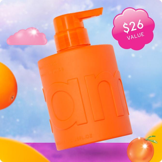 image of amika's hand wash floating in a whimsical background with floating sea buckthorn berries. A sticker reads "$26 value"