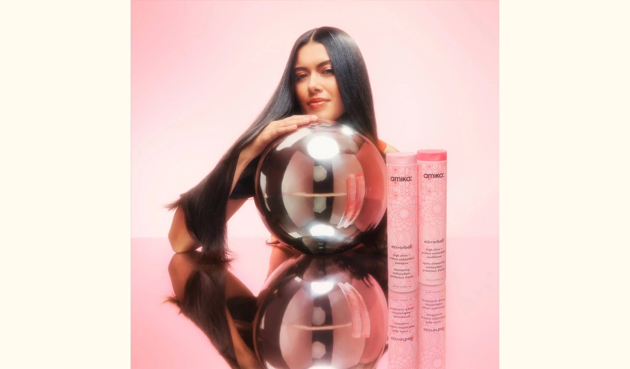model posing with mirrorball high shine + protect antioxidant shampoo and conditioner