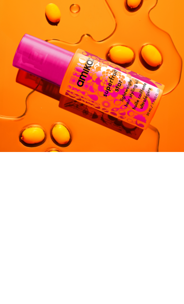 bottle of superfruit star against an orange background