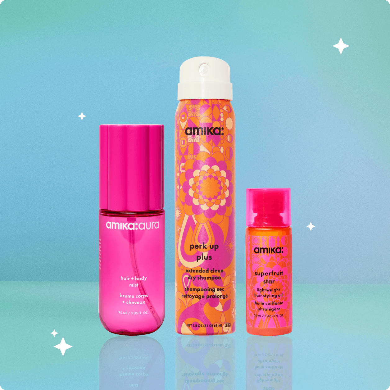 amika perk up plus, amika:aura hair + body mist, and superfruit star hair oil are posed against a light blue background