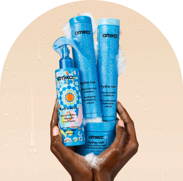 amika hydration collection hero products: hydro rush shampoo + conditioner + leave-in conditioner + moisture mask bottles.