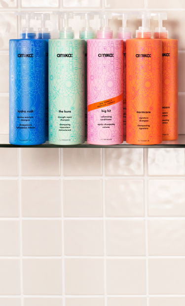 liter-sized bottles of amika shampoos + conditioners
