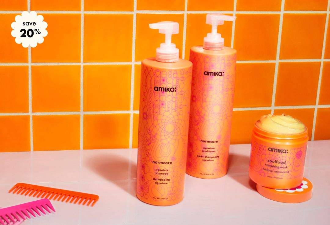 save 20% on your custom amika super-sized wash + care bundle. Bottles of shampoo, conditioner, and a jar of soulfood mask against an orange tiled background