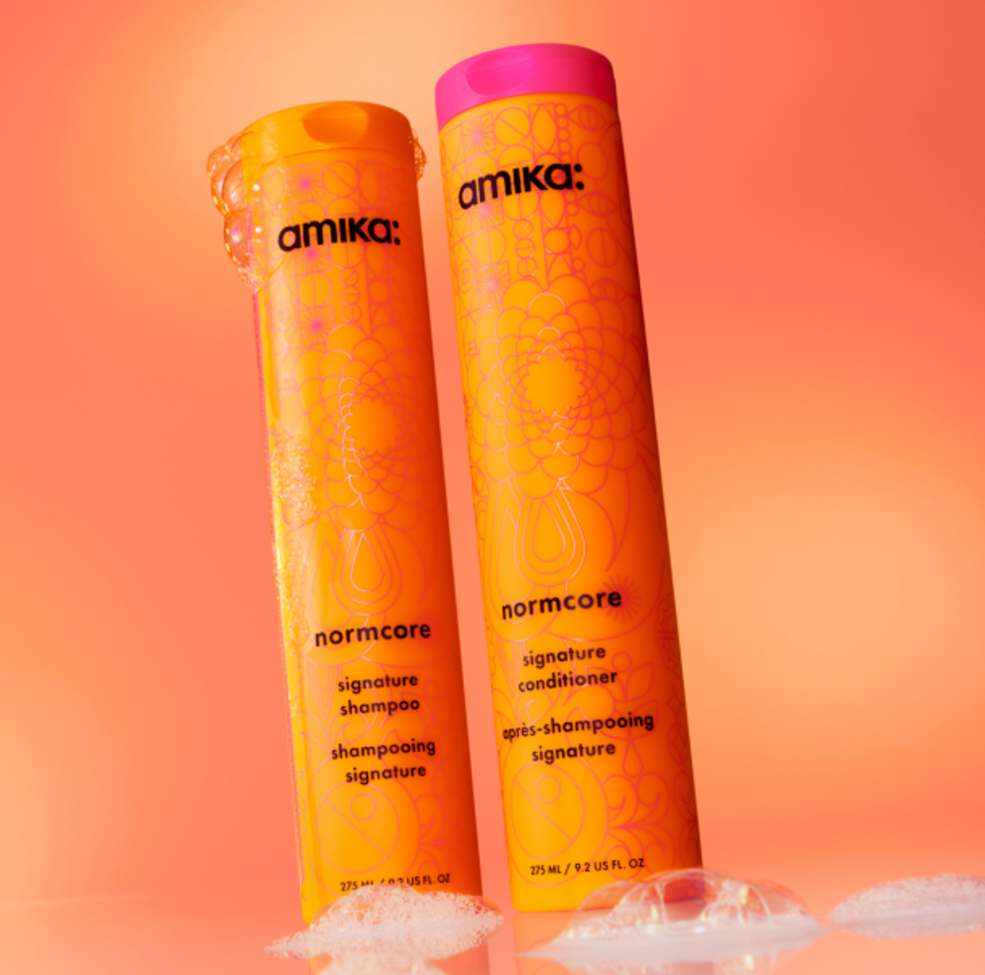 bottles of amika normcore nourishing shampoo + conditioner