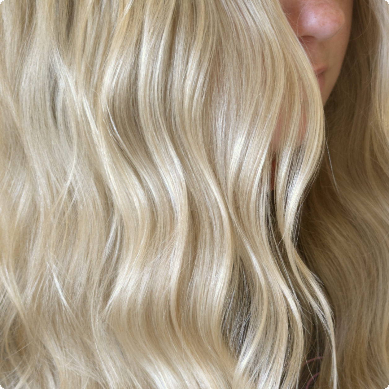 close up of a woman's blonde, wavy hair