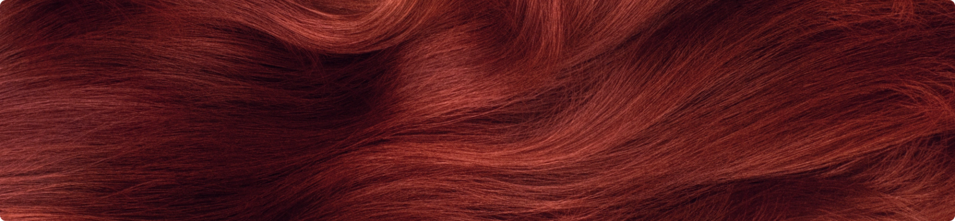 close-up image of vibrant, wavy red hair