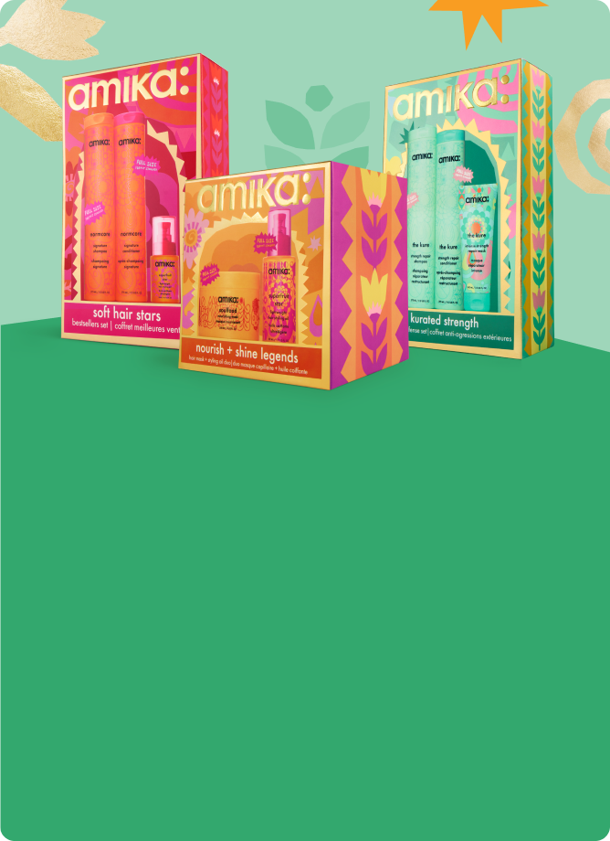 3 amika holiday gift sets against a green background with some pastel shapes behind them