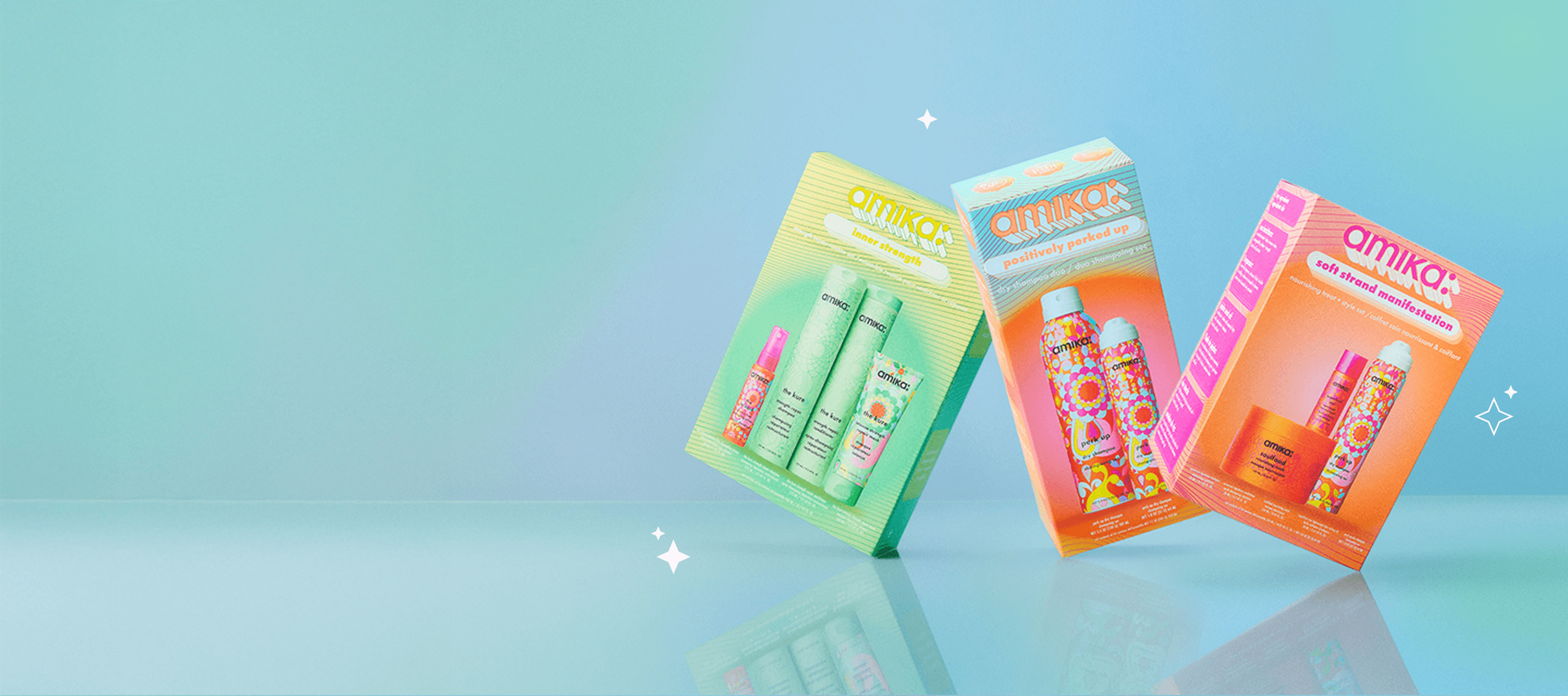 amika gift sets soft strand manifestation, positively perk up, and inner strength are set against a light blue backround