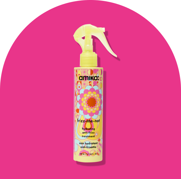 Image of the frizz-me-not treatment against a hot pink background.