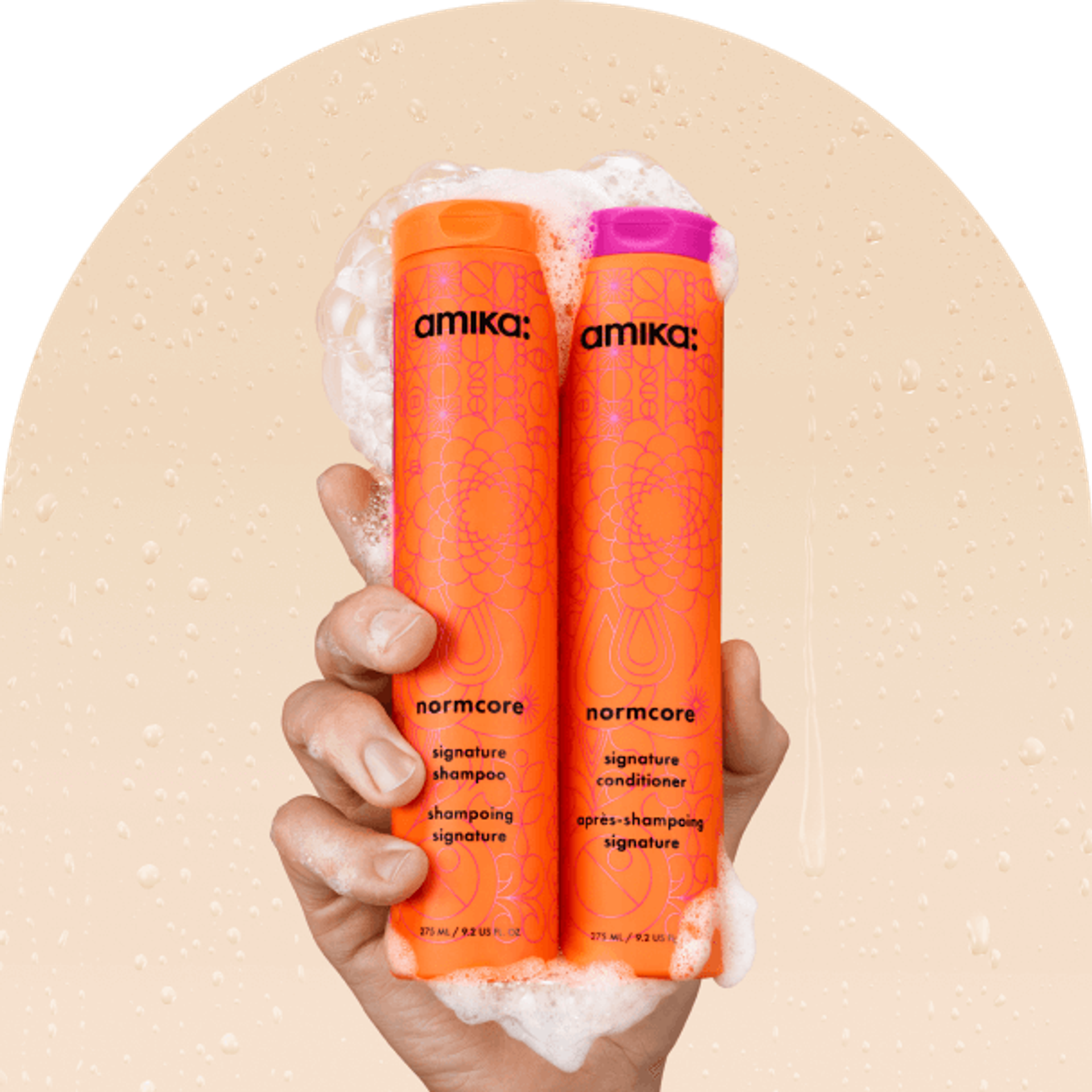 image of the normcore shampoo and conditioner with foams against a beige background.