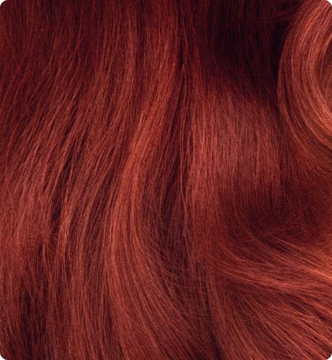 close-up image of vibrant, wavy red hair