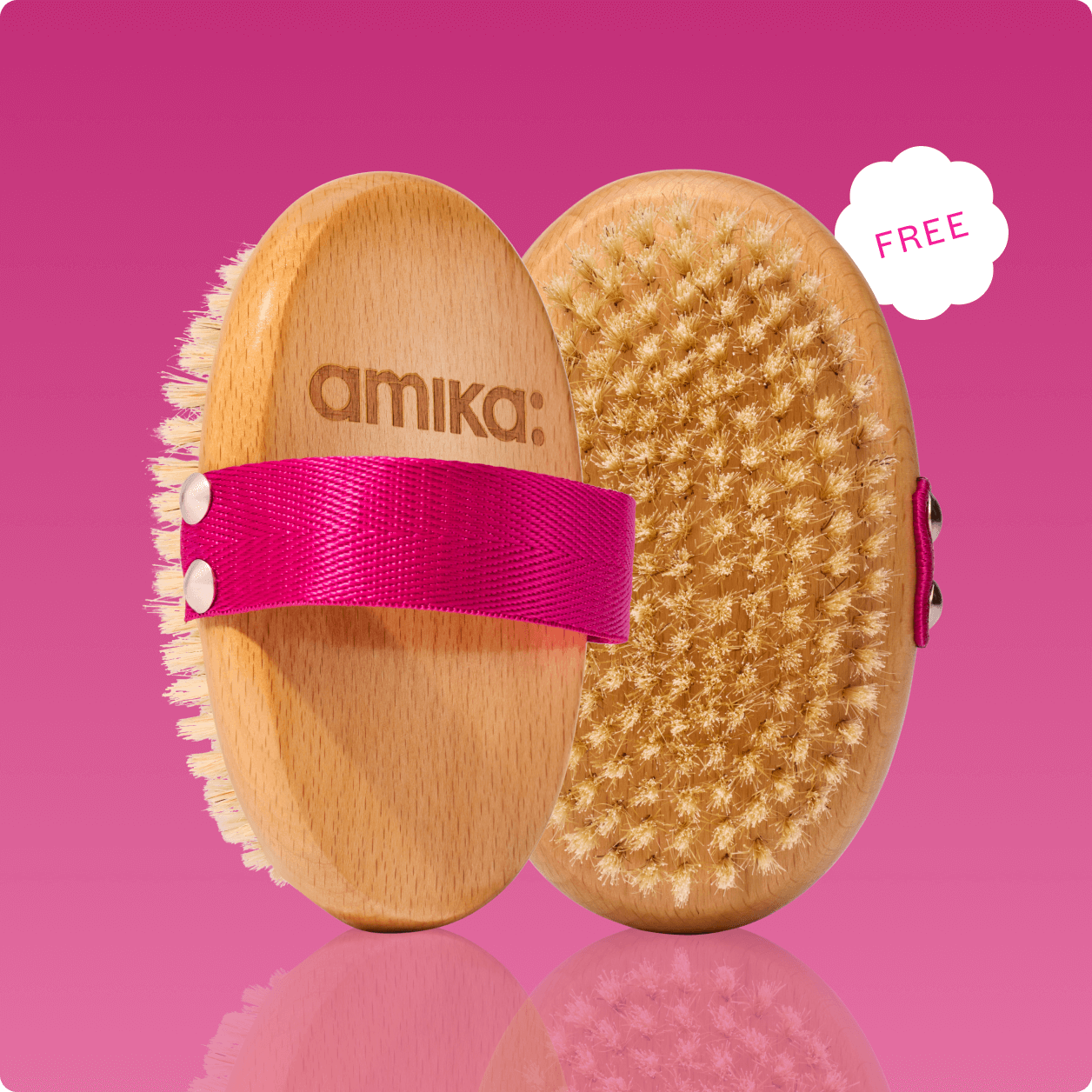 an amika dry brush featured with front and back against a pink background and a sticker that says FREE