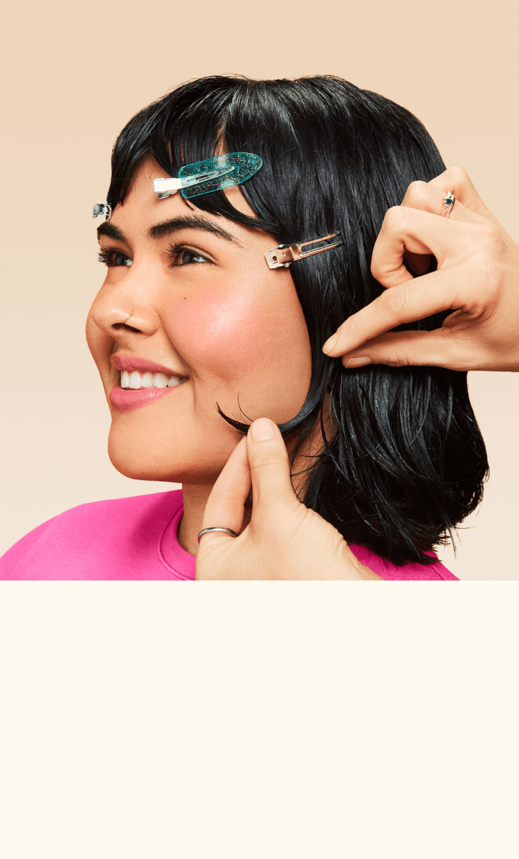 Image for stylist collective, shows a model having hair done