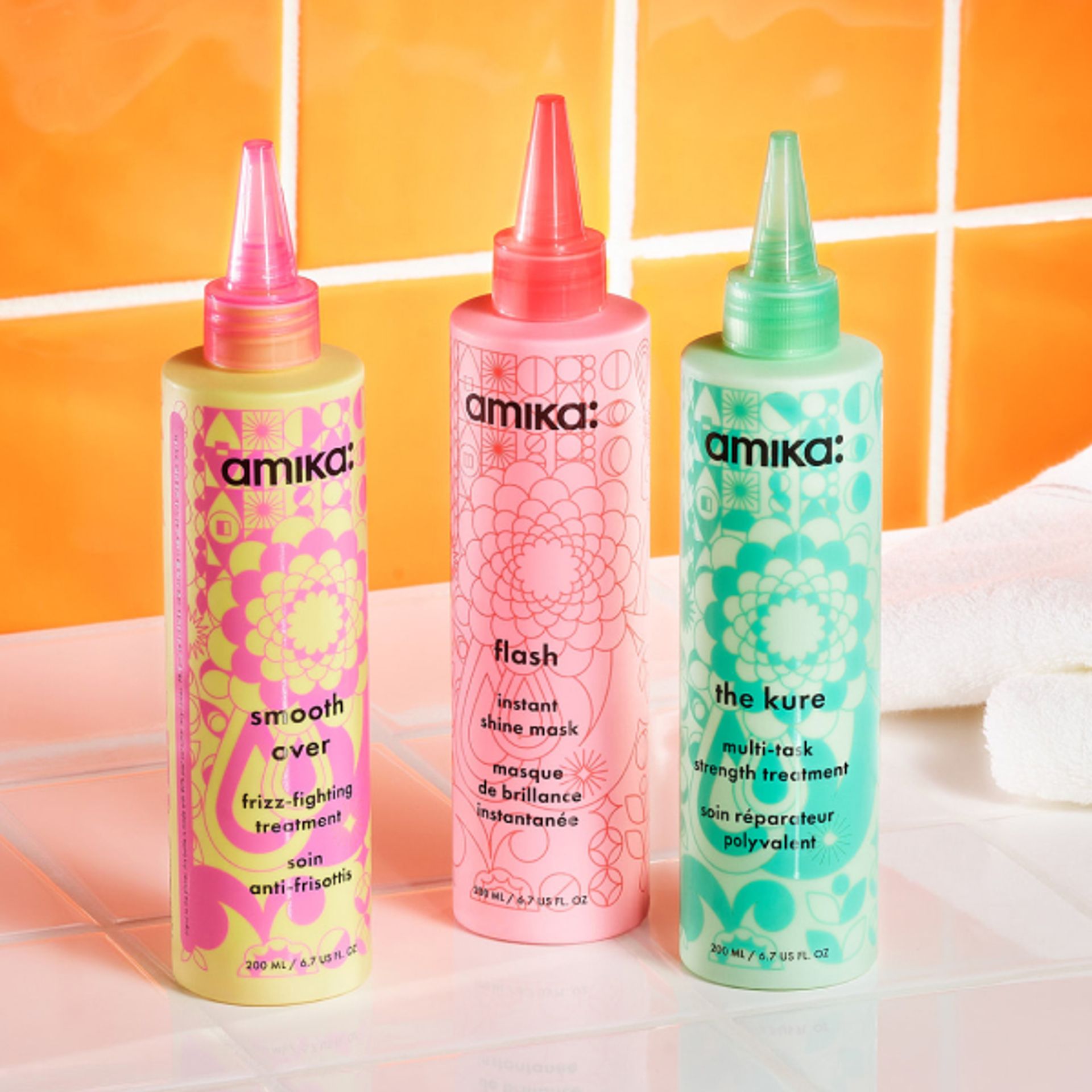 image of our 60 second treatments: smooth over frizz-fighting treatment, flash instant shine mask, and the kure multi-task strength treatment.