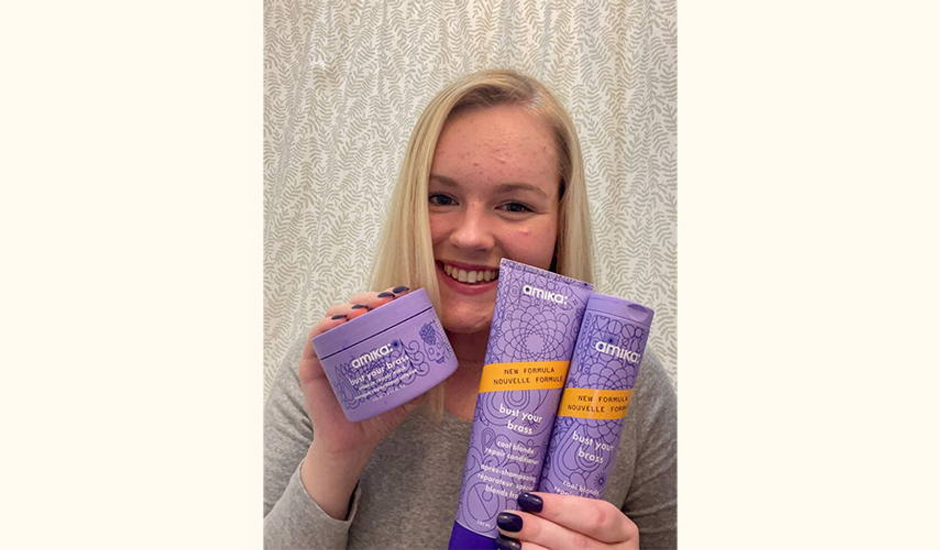 person holding bust your brass cool blonde shampoo and conditioner and bust your brass cool blonde intense repair mask