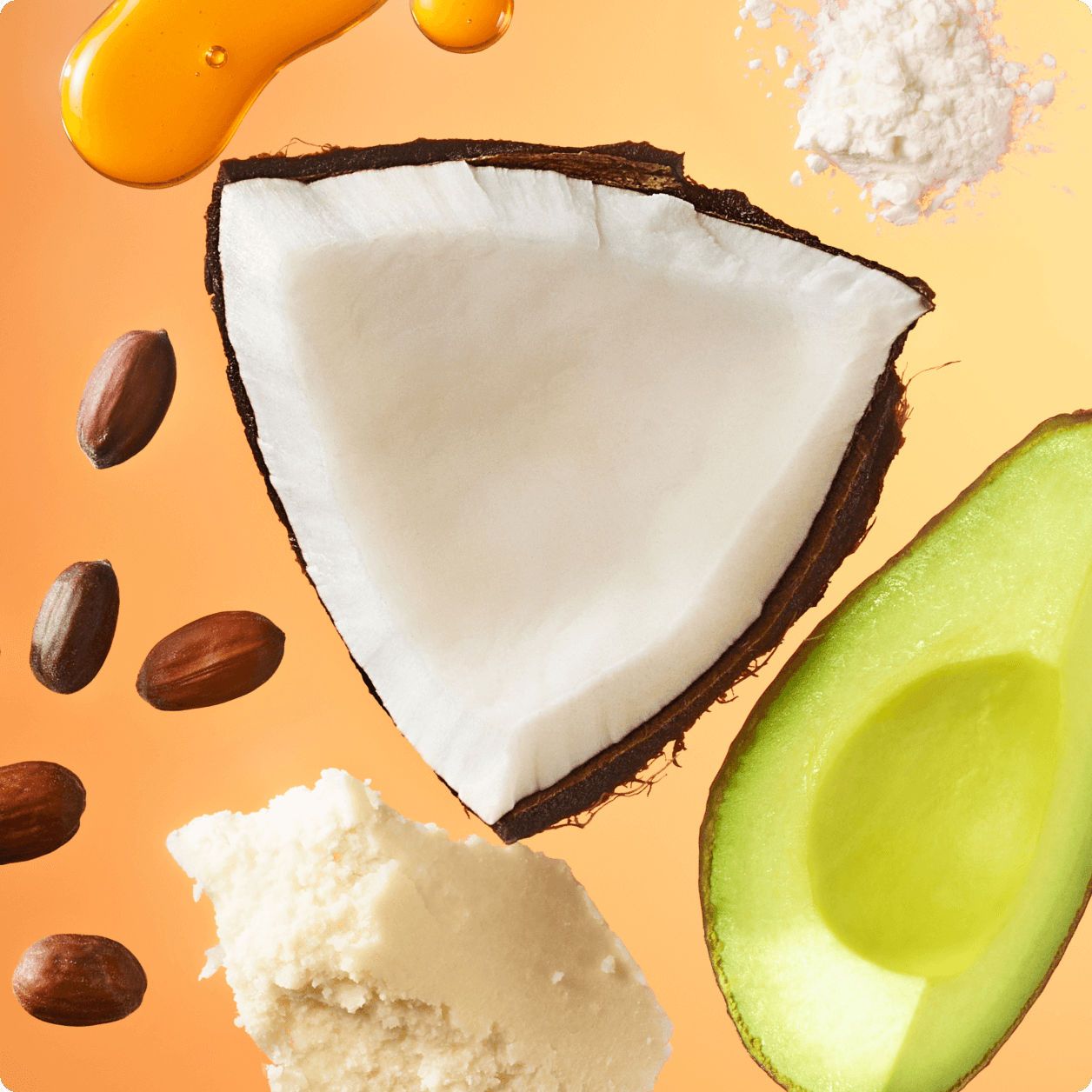Image of a cut coconut, cut avocado, nuts, butter, powder and oil against an orange background.