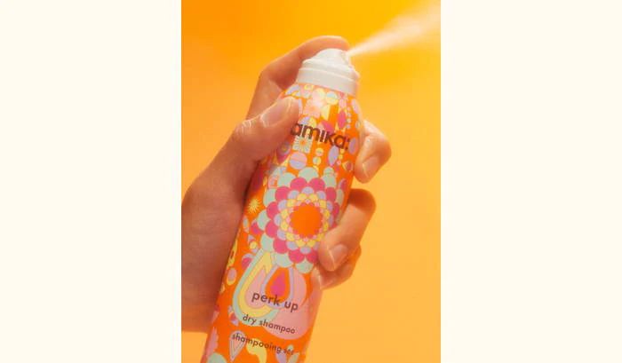 model spraying perk up dry shampoo