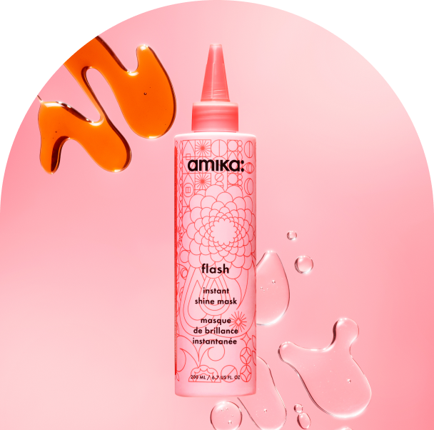 bottle of amika flash instant shine mask against a pink background