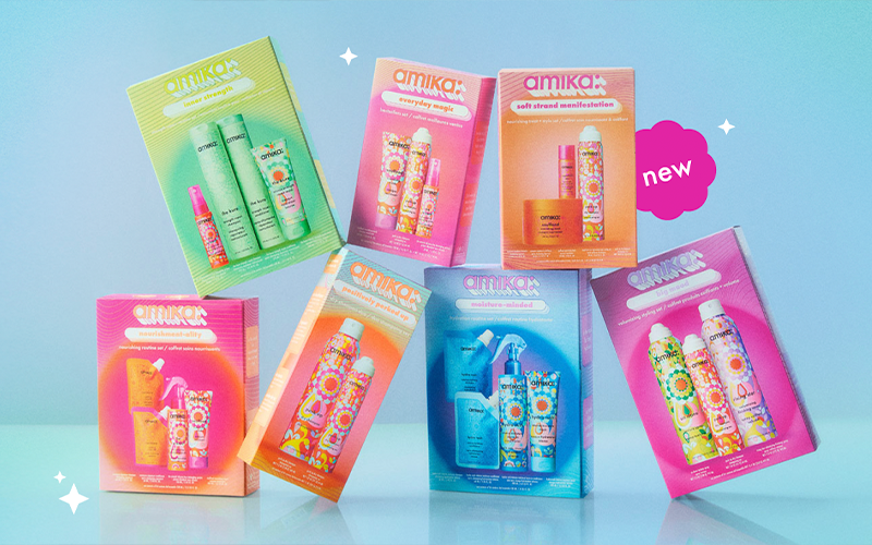 7 amika limited-edition holiday haircare gift sets are stacked against a blue background. a sticker reads: "new"