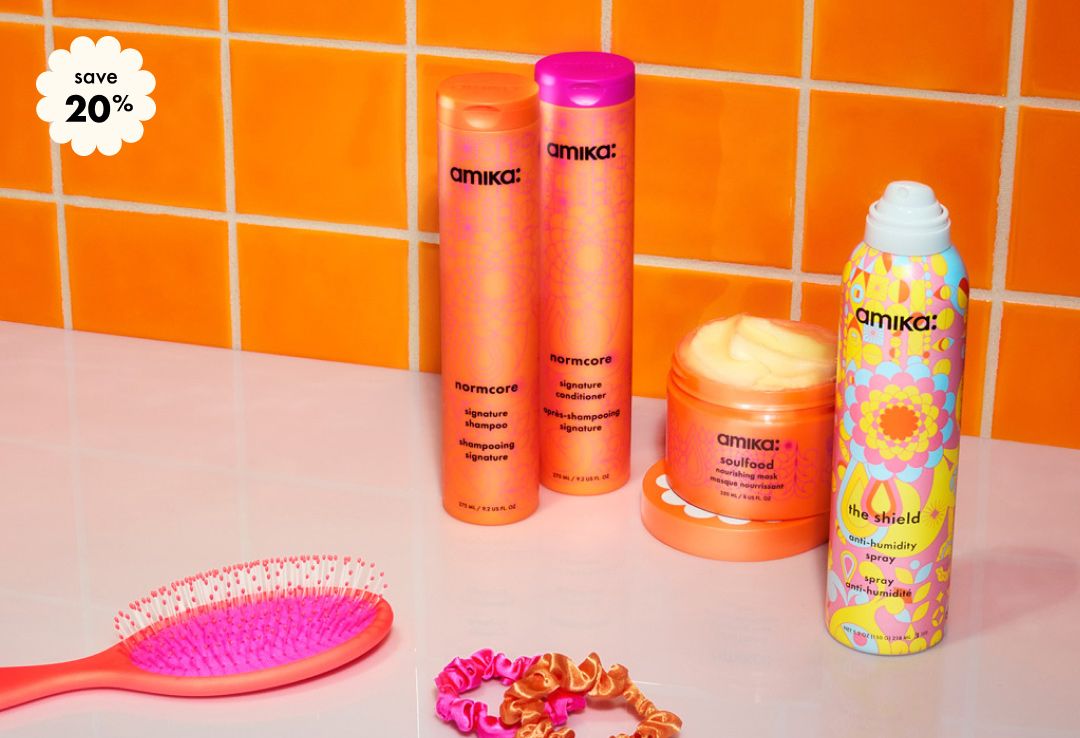 save 20% on your custom amika wash, style + treat bundle. Bottles of shampoo, conditioner, the shield spray and a jar of soulfood mask against an orange tiled background