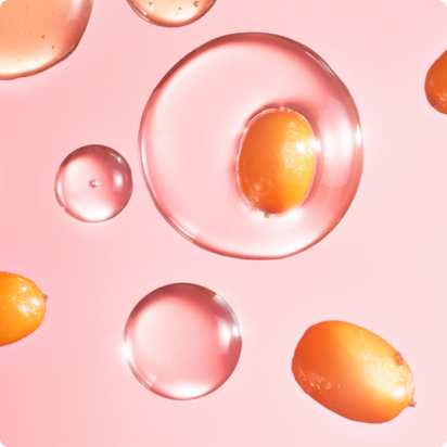 Image of sea buckthorn berry in the center of a droplet.