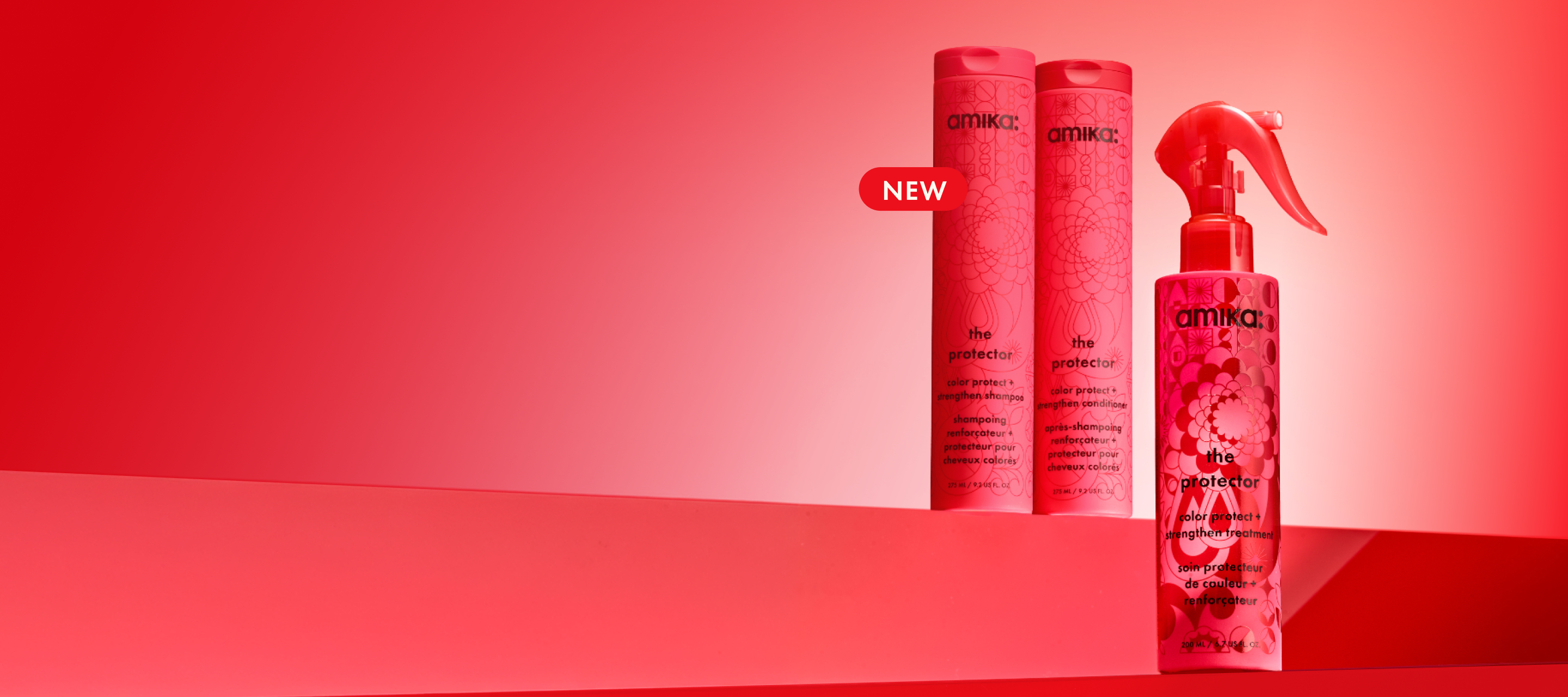 bottles of amika's the protector shampoo, conditioner, and treatment sit against a red gradient background