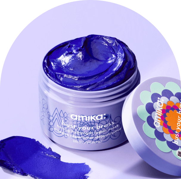 amika bust your brass repair mask against a light purple background