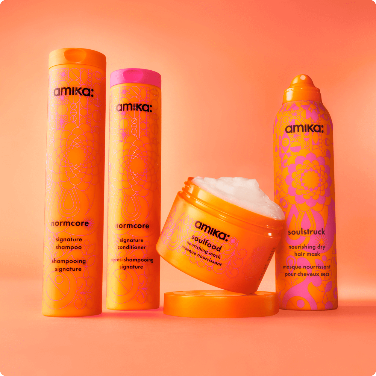 amika products in front of a orange gradient background