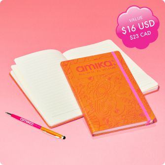 pen and notebook gwp on pink background