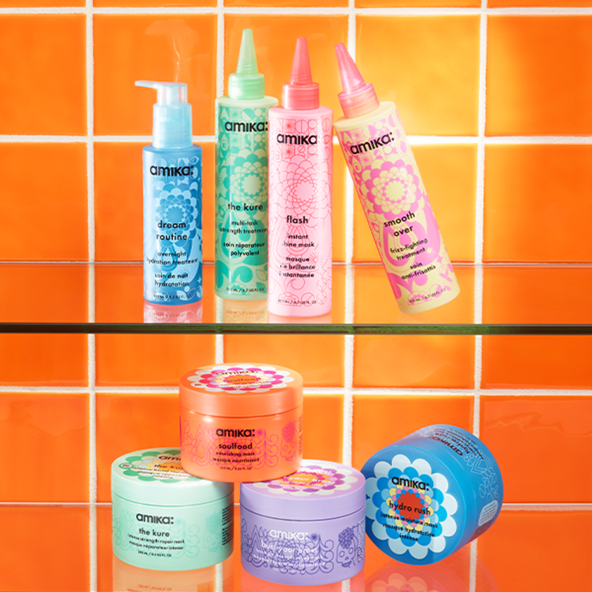 amika masks and treatments on a glass shelf against an orange tiled background