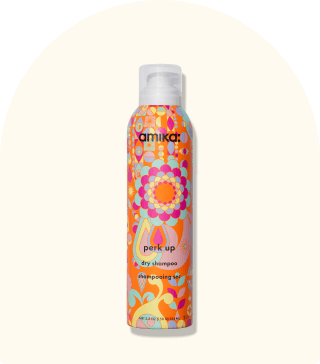 image of the perk up dry shampoo against a cream background.