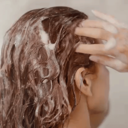 gif of a model lathering their hair