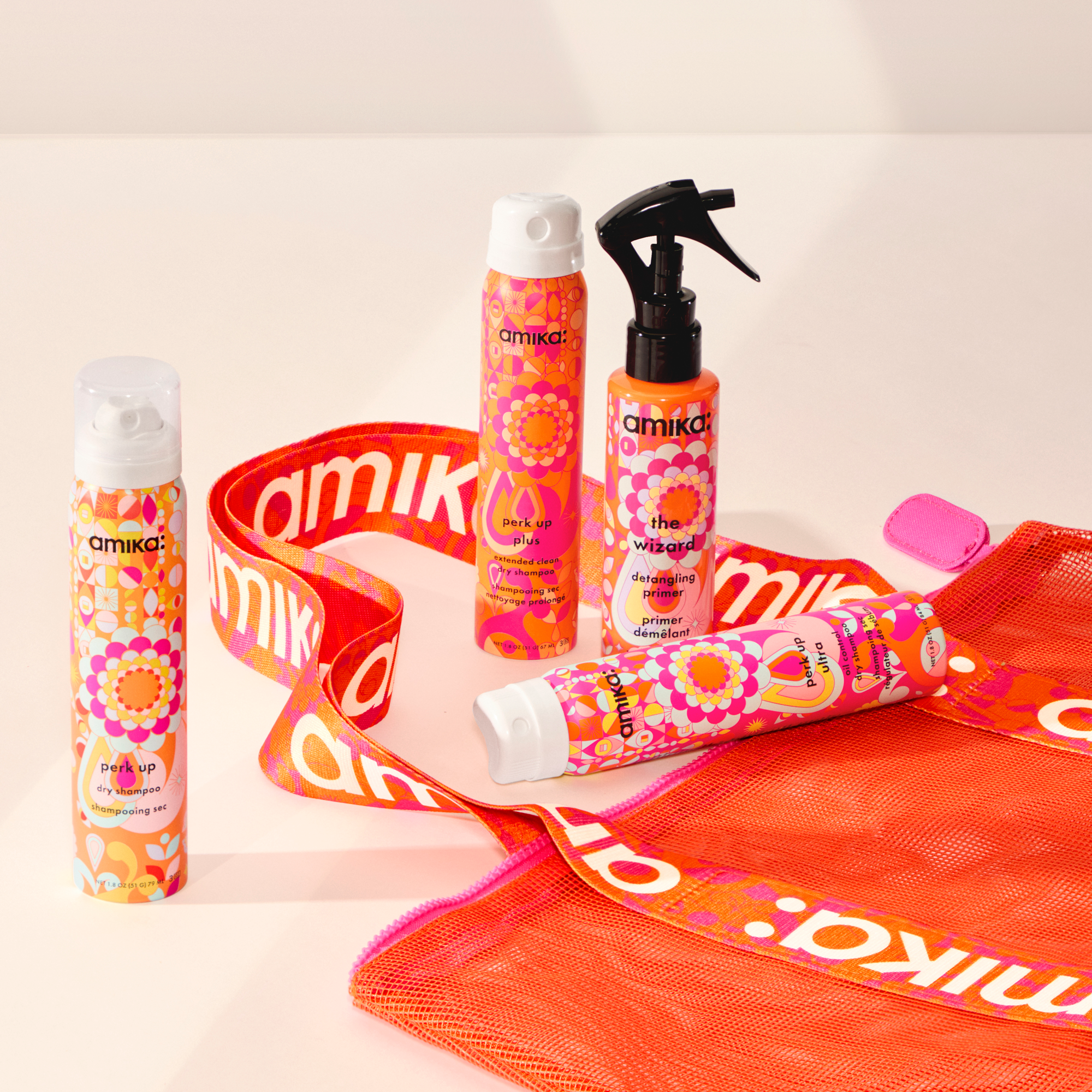 amika limited time gift with purchase: 3 travel sized dry shampoos: perk up, perk up ultra, and  perk up plus, along with a mesh beach tote bag with amika logo handles. additionally, VIP customers can add a 4 oz wizard detangling primer.