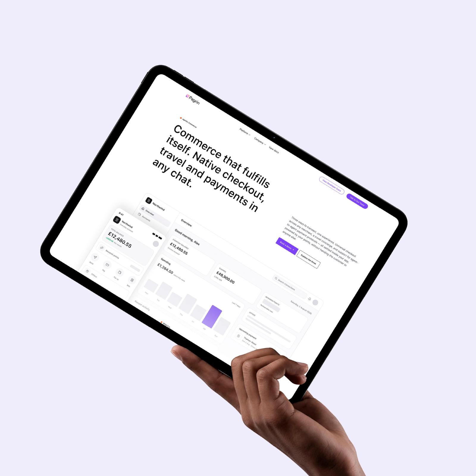 A hand holding a tablet showing the commerce page — Commerce that fulfils itself.