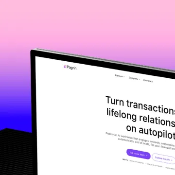 The Pagrin marketing site on a monitor, angled against a pink-to-purple gradient.