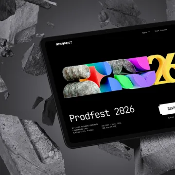 The ProdFest 2026 website on a tablet, angled above grey rubble.