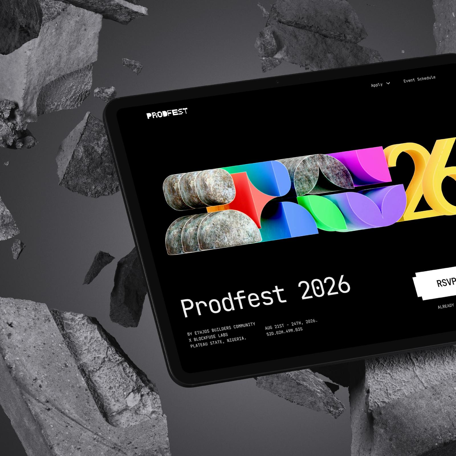 The ProdFest 2026 website on a tablet, angled above grey rubble.