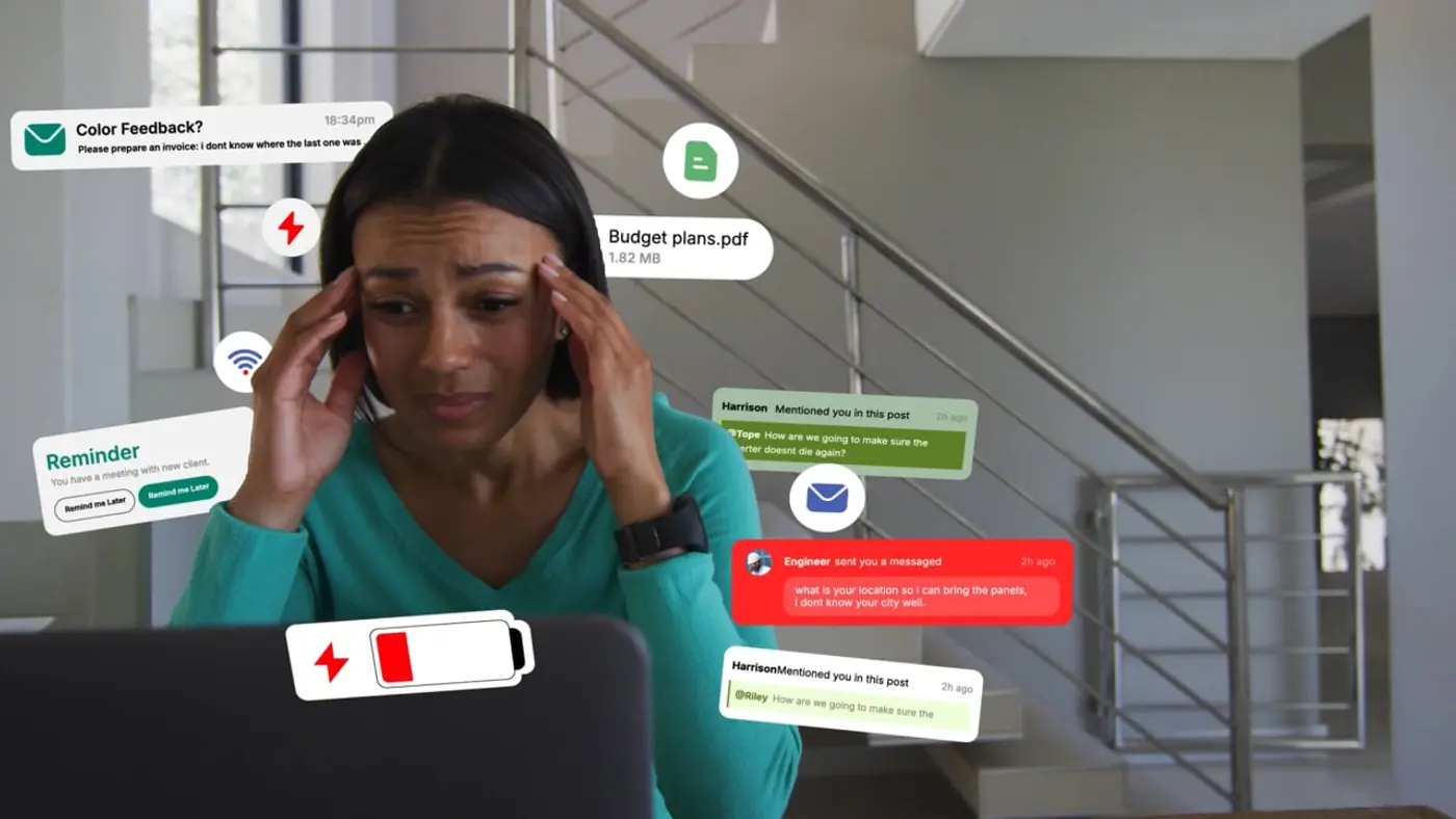 A woman at a laptop overwhelmed by overlapping chat notifications, reminders and file alerts.