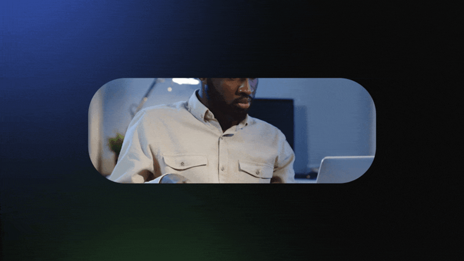 A creator working at a laptop, framed in the brand's rounded shape.