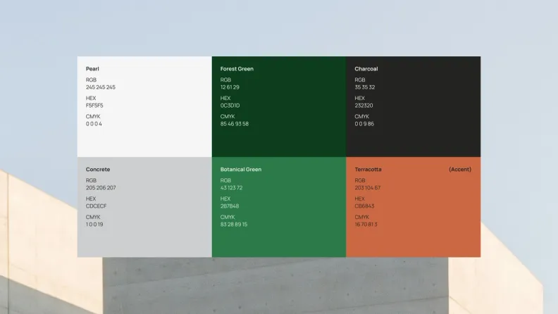 The Grey Goose colour palette over a concrete building: pearl, forest green, charcoal, concrete, botanical green and a terracotta accent, each with RGB, hex and CMYK values