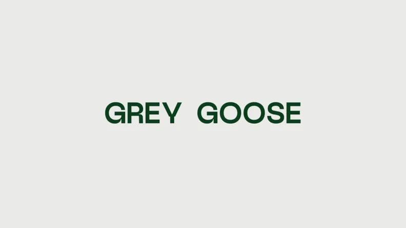 The Grey Goose wordmark in forest green on pearl