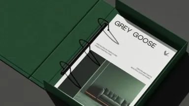 A green cloth ring binder holding the Grey Goose capabilities document, Specialising in complex and unique construction