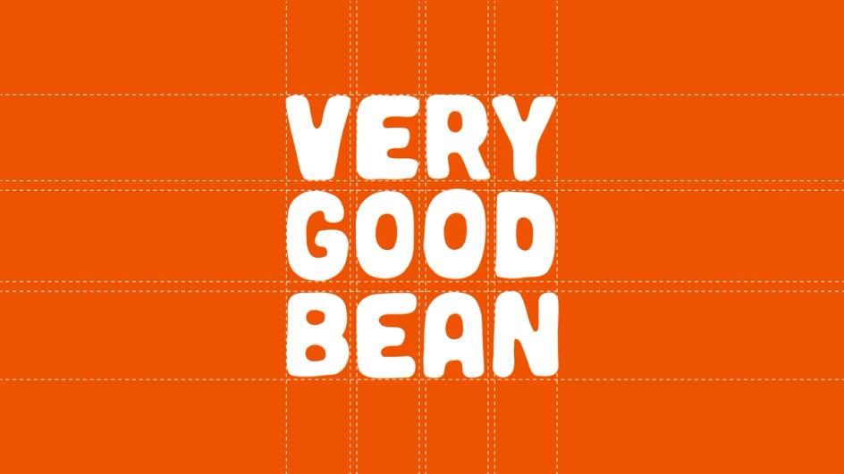 The Very Good Bean wordmark in white on orange, set on its construction grid