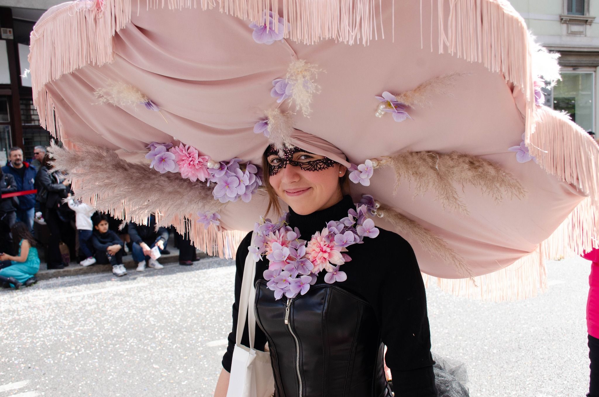 Allegorical floats and costumed groups during the Mid-Lent parade in Bergamo.