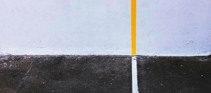 a line going across pavement and up a wall