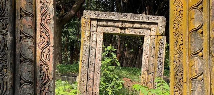 Framed Square Rock Arches in woods.