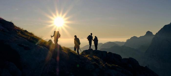 four person on mountain during daytime