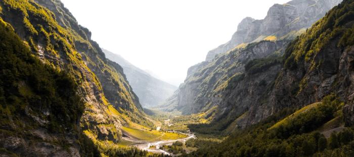 green valley between mountains