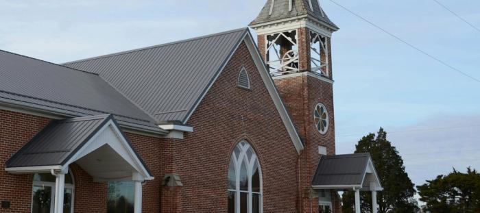 A church with a steeple and a clock tower
