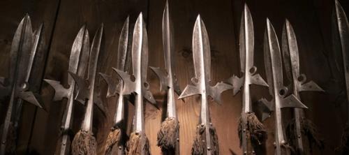 Several medieval spears in a row.
